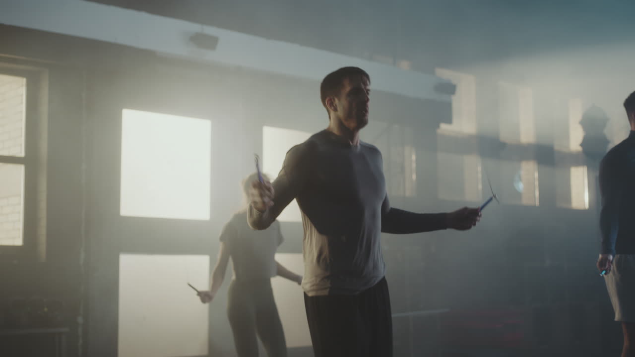 Men jumping rope in a gym