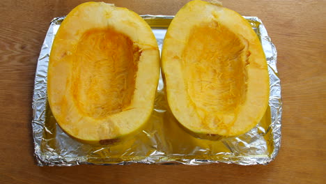 preparing spaghetti squash to go into the oven