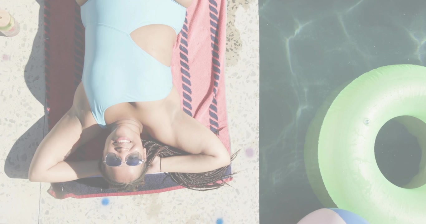 Woman sunbathing on red towel by pool, glitch artifacts emerging, growing across frame for tech ad