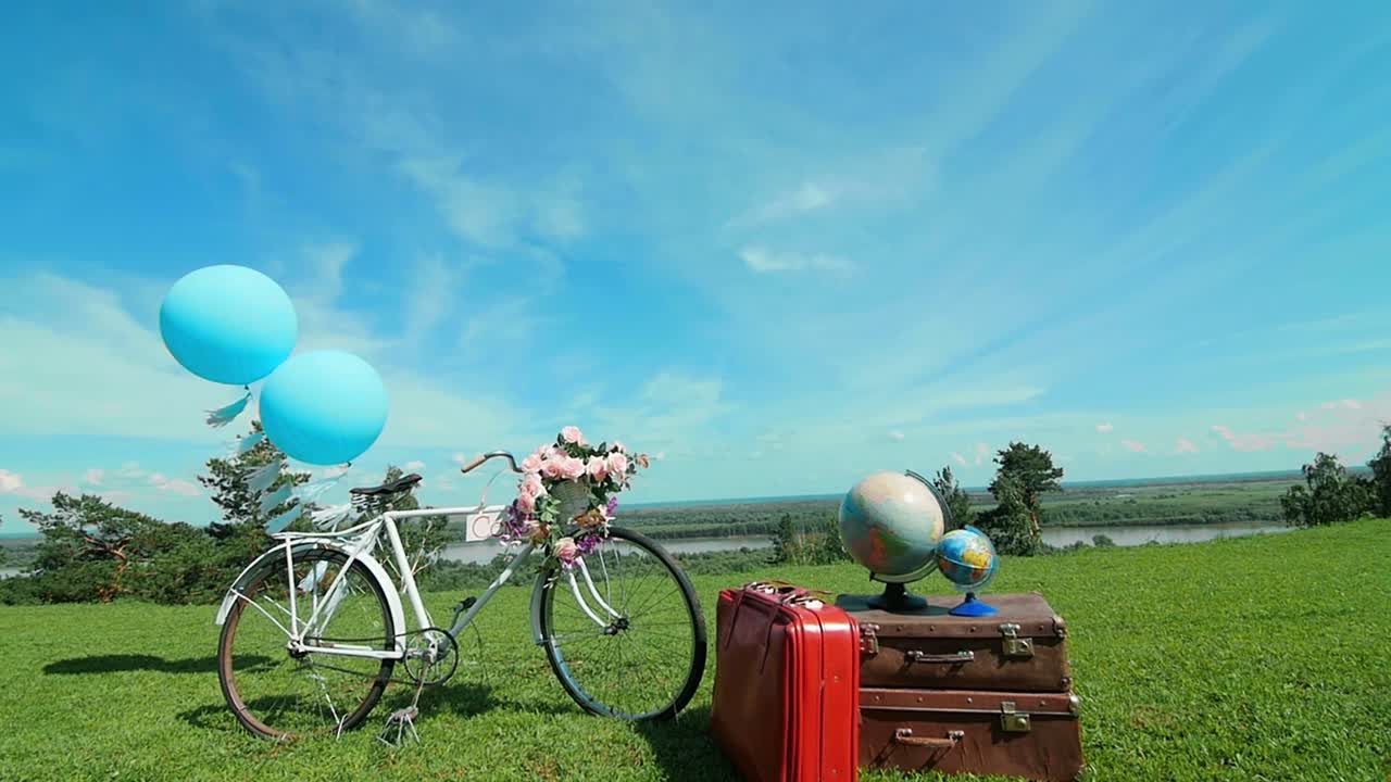 Vintage Bicycle with Suitcases and Balloons