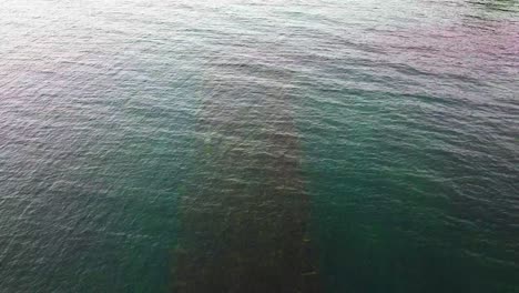 aerial-view-hidden-boat-in-lake-on-overcast-day