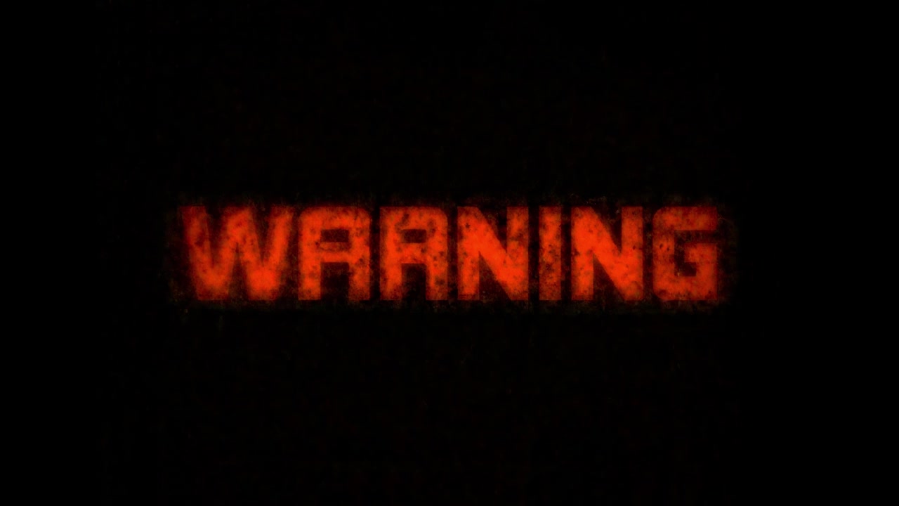Red flashing warning text message, appearing against a black background