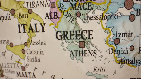 close-up of a map or globe showing greece, italy, and surrounding mediterranean countries