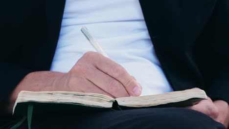 writing in a notebook