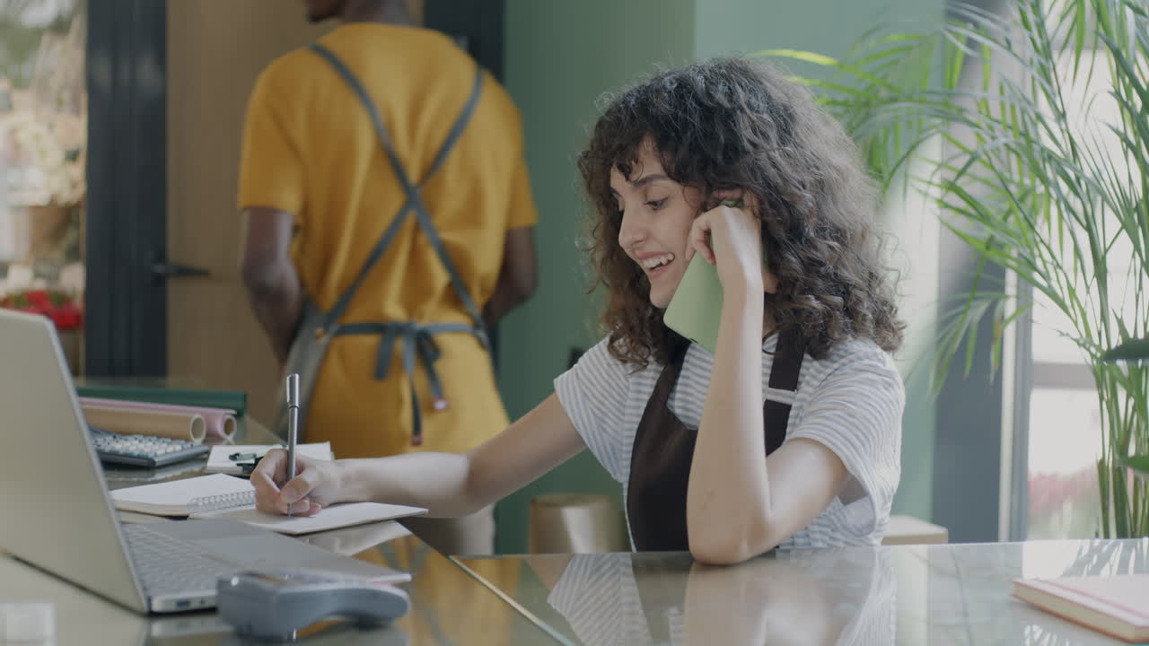 Woman working in a flower shop