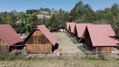 lateral shot of wooden cottage cabins at shinny morning time