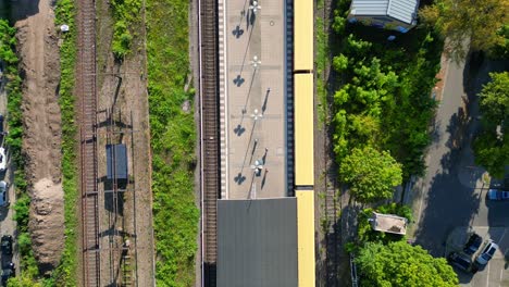 train station in berlin zehlendorf with yellow suburban trains on the tracks