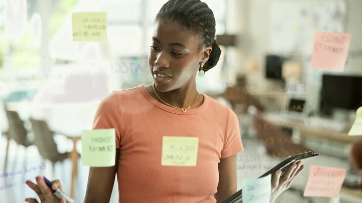 Woman working on digital tablet in office