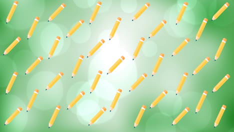animación digital de varios iconos de lápices flotando contra puntos de luz sobre un fondo verde