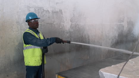 man cleaning marble piece