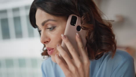 portrait business woman calling at office work space. smiling woman consulting