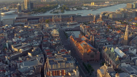 circling drone shot over damrak amsterdam central station