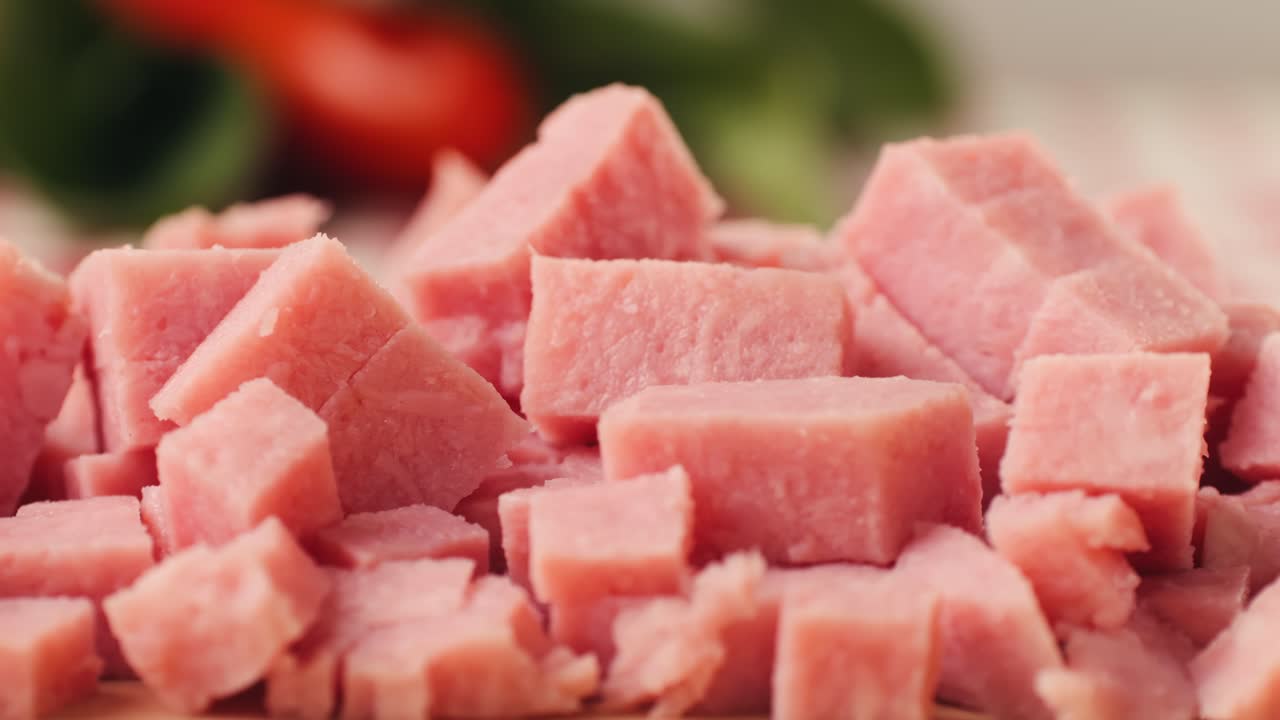 Ham italian mordatella, man Slices Of Traditional Italian antipasti mortadella sausage on a wooden cutting board, close up macro of chicken or turkey jamon, fat breakfast dish.