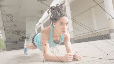 Network-of-connections-against-african-american-woman-performing-plank-exercise-in-the-park