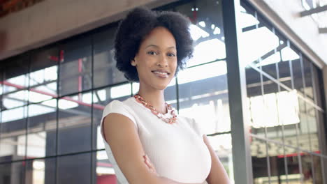 african american businesswoman standing confidently with arms crossed