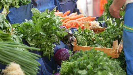 man buying fresh vegetables at a farmer's market