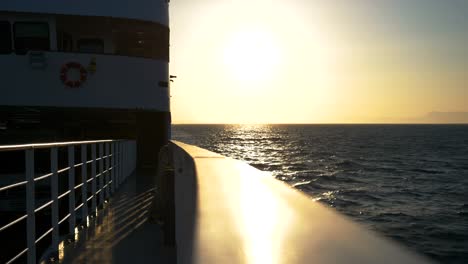 view from the ferry deck over the greek waters of the ionian sea during sunset