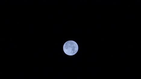 close up of night view the moon moves across the night