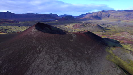 red crater surrounded by a lava field at snæfellsnes peninsula