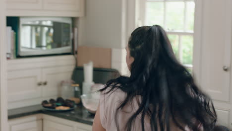 happy overweight teenage girl dancing in kitchen having fun celebrating healthy diet preparing food at home enjoying lifestyle commitment