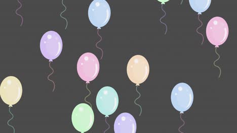 Multiple-balloons-flying-against-grey-background