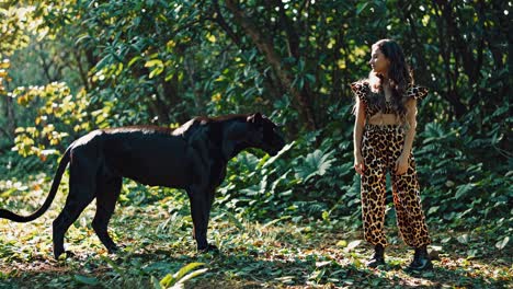 girl interacting with a black panther in the jungle