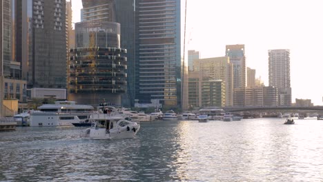 dubai marina waterways with private yachts sailing canals, slow motion shot