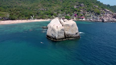 adventurous individuals leap from the towering rock formation