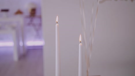 close-up of lit candles with a soft glow, conveying warmth and tranquility