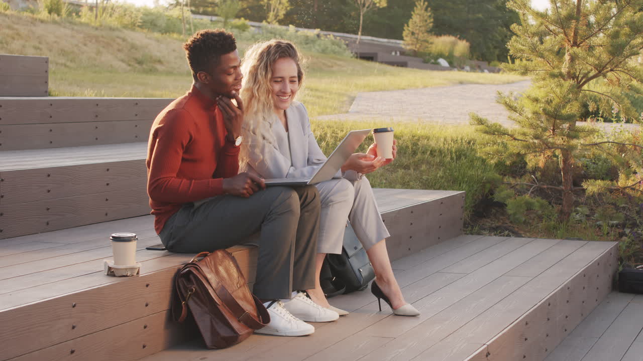 Business Couple Working Outdoors Together