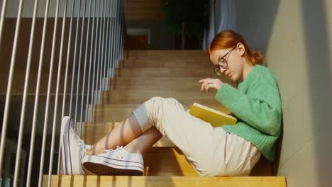 girl reading on stairs