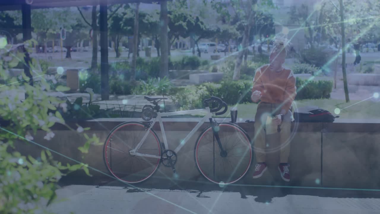 Animation of network of connections over man in city