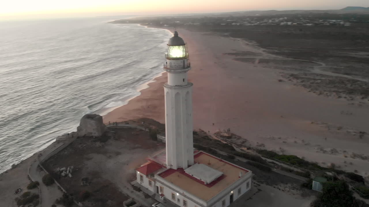 Aerial view of Cape Trafalgar lighthouse at sunset.