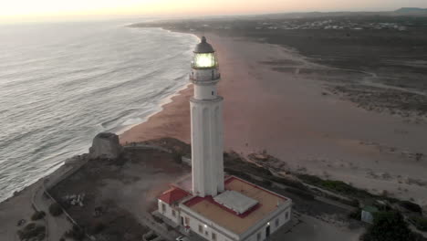 aerial view of cape trafalgar lighthouse at sunset.