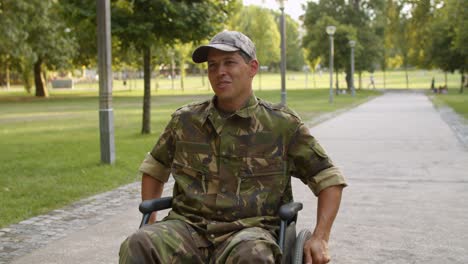 happy disabled military man in wheelchair