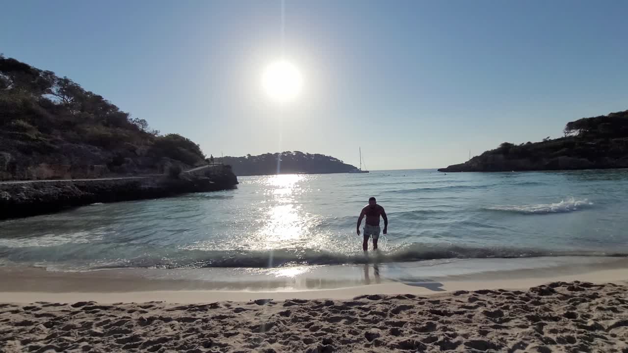 man coming out of the sea