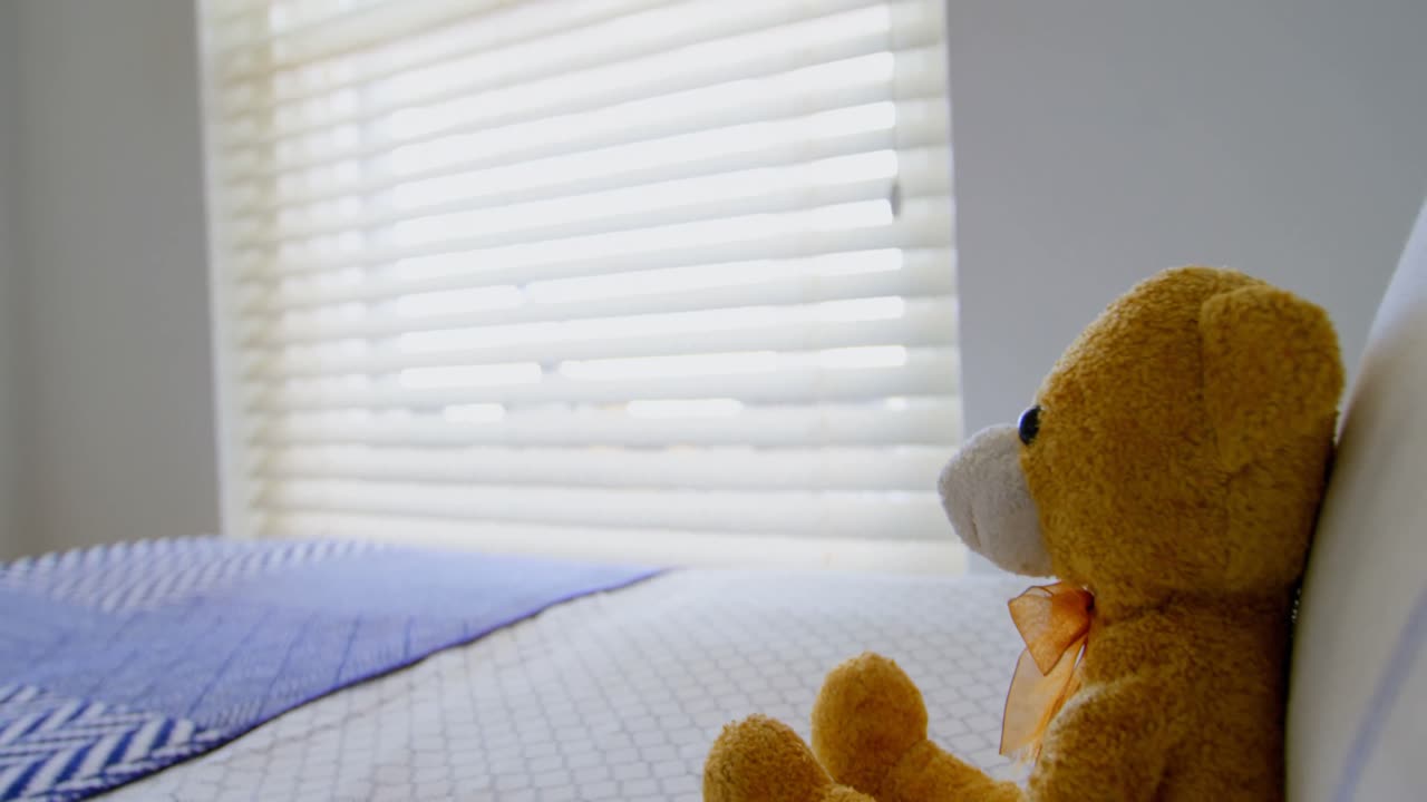 Teddy bear on bed in bedroom at home 4k
