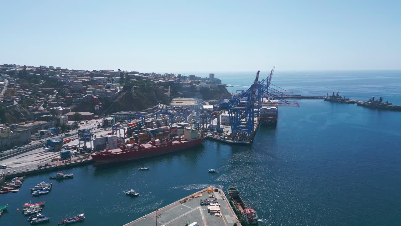 Drone View of a Commercial Port with Cranes, Containers and Cargo Ships on a Sunny Day in Valparaiso, Chile