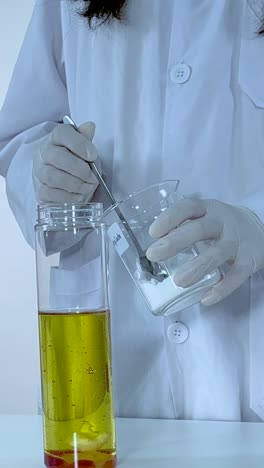 scientist demonstrates a colorful lava lamp experiment