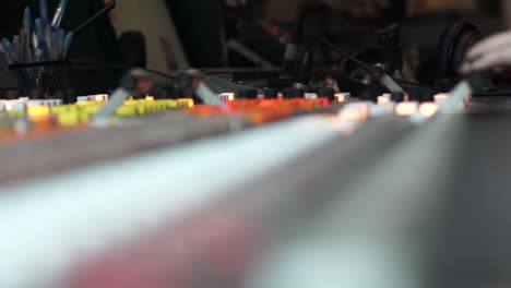 audio mixing console in a broadcast studio