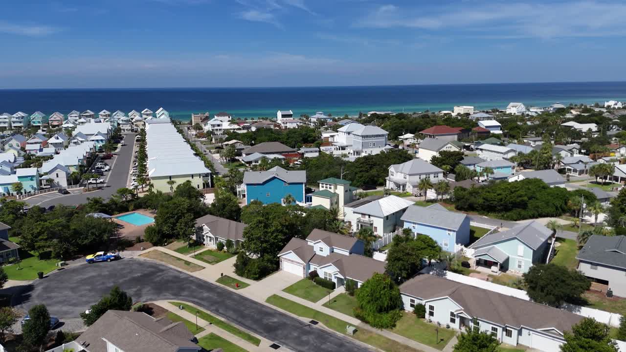 Dynamic panoramic drone movement over the modern residential area of Panama City Beach, Florida, USA