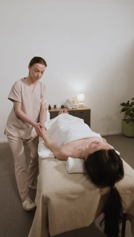 woman receiving an arm massage at a spa