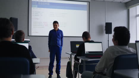 students presenting in a computer science classroom