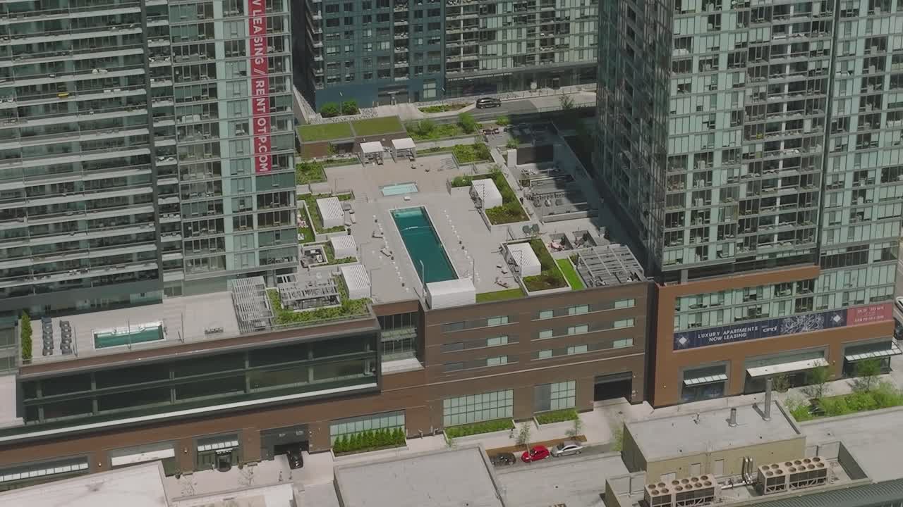 Aerial view of modern buildings with rooftop pool in Chicago