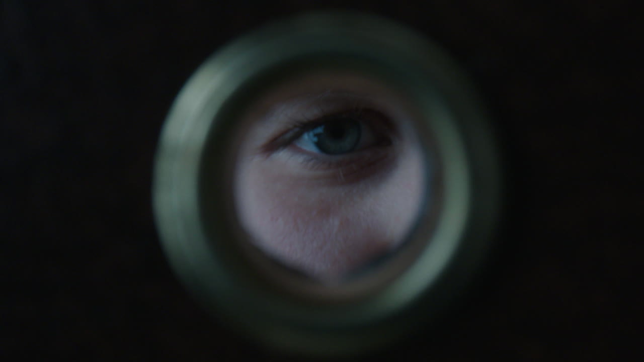 Eye Peeking Through a Hole