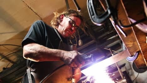 welder using welding torch