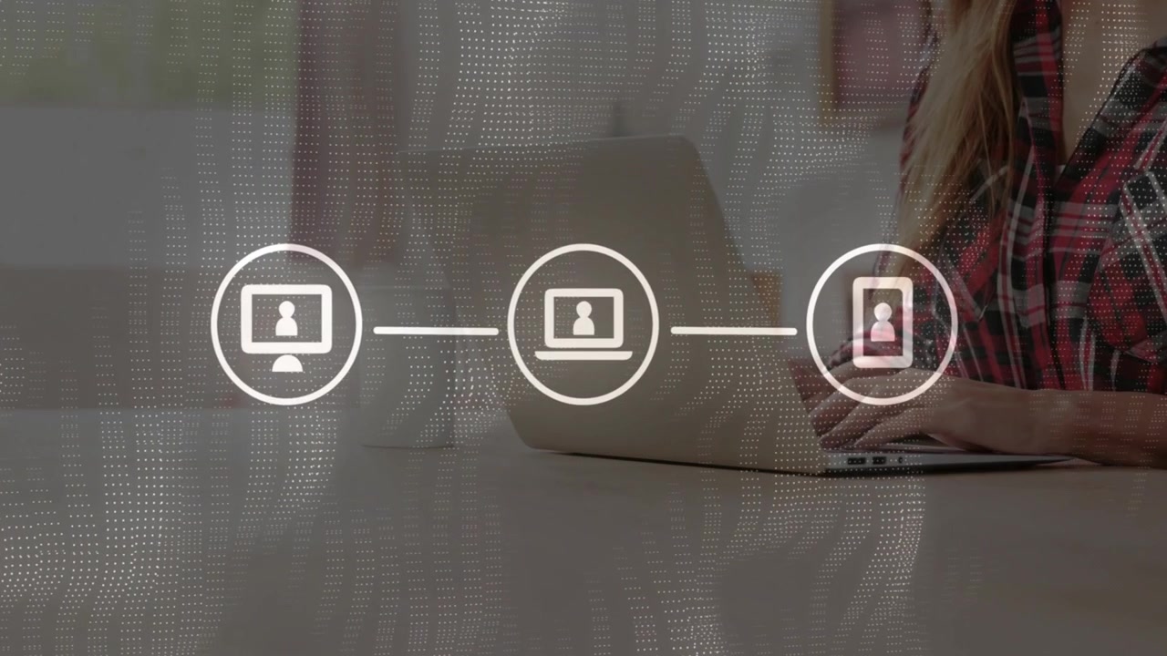 Woman typing at laptop, overlay icons appearing and linking, phone pulsing, showing tech syncing