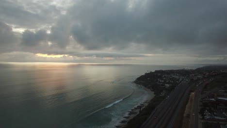 A-beautiful-aerial-above-waves-rolling-into-the-California-coastline-north-of-San-Diego-3