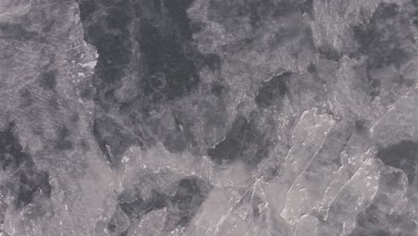 birdseye view of the hudson river's frozen surface during a new york winter.