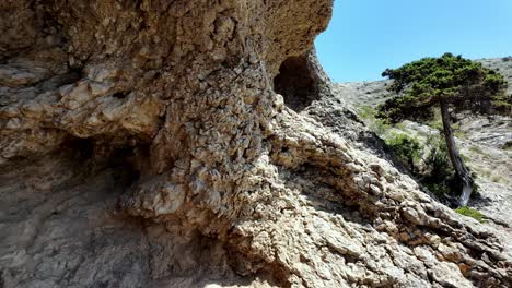 A-view-of-the-rocky-cliffs-near-Sudak-in-Crimea,-Russia,-showcasing-the-natural-beauty-of-the-region-on-a-sunny-day